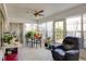 Enclosed sunroom featuring a ceiling fan, tile flooring, and several windows at 2505 Beneva Rd # 3, Sarasota, FL 34232
