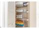 Organized linen closet with multiple shelves for ample storage of towels and bedding at 3243 Sunset Beach Dr, Venice, FL 34293