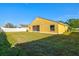 Spacious backyard featuring a well-maintained lawn and a white fence, perfect for outdoor activities at 3503 14Th E Ct, Ellenton, FL 34222