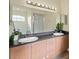 Bright bathroom featuring dual sinks, large mirror and walk-in shower at 3503 14Th E Ct, Ellenton, FL 34222