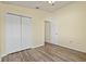 Comfortable bedroom with ceiling fan and double closet for storage at 3503 14Th E Ct, Ellenton, FL 34222