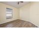Bright bedroom features a large window, wood-look floors and neutral paint at 3503 14Th E Ct, Ellenton, FL 34222
