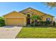 Charming yellow home with a well-maintained lawn and manicured landscaping at 3503 14Th E Ct, Ellenton, FL 34222
