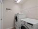 Convenient laundry room with washer, dryer and shelving unit at 3503 14Th E Ct, Ellenton, FL 34222