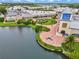 Aerial view of Ellenton Premium Outlets, a shopping center with lush landscapes, a pond, and vibrant shops at 3503 14Th E Ct, Ellenton, FL 34222