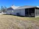 Spacious backyard with a screened-in patio, ideal for outdoor relaxation and entertainment at 3608 67Th Street Ct W, Bradenton, FL 34209