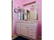 Unique pink bathroom features a vanity with a mirror at 3608 67Th Street Ct W, Bradenton, FL 34209