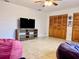 Relaxing bonus room with beanbag chairs and a large TV, perfect for entertainment and comfort at 3608 67Th Street Ct W, Bradenton, FL 34209