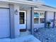 Inviting front entrance featuring a well-lit porch, manicured landscaping, and a visible house number at 3608 67Th Street Ct W, Bradenton, FL 34209