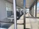 View of screened lanai from inside through the sliding glass doors at 3608 67Th Street Ct W, Bradenton, FL 34209