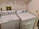 Clean laundry room featuring a Kenmore washing machine and Whirlpool dryer at 3608 67Th Street Ct W, Bradenton, FL 34209