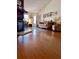 Cozy living room features hardwood floors, comfortable seating, and fireplace at 3608 67Th Street Ct W, Bradenton, FL 34209