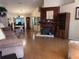 Open-concept living room featuring a fireplace and wood floors, creating a warm and inviting space at 3608 67Th Street Ct W, Bradenton, FL 34209