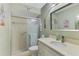 Neutral bathroom features a step-in shower with a glass door, vanity, and ample counter space at 4091 Center Pointe Pl # 40A, Sarasota, FL 34233