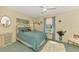 Bright bedroom with a bed, an area rug, a ceiling fan, and a sunny window at 4091 Center Pointe Pl # 40A, Sarasota, FL 34233