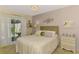 Comfortable bedroom featuring a plush bed, soft colors, and sliding glass doors to the patio at 4091 Center Pointe Pl # 40A, Sarasota, FL 34233