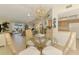 Inviting dining area with view of the living room and sliding doors to the backyard at 4091 Center Pointe Pl # 40A, Sarasota, FL 34233
