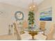 Bright dining area featuring a glass table, rattan chairs, and coastal decor at 4091 Center Pointe Pl # 40A, Sarasota, FL 34233