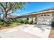 Lovely single-story home with manicured landscaping, a screened-in porch, and a driveway leading to the garage at 4091 Center Pointe Pl # 40A, Sarasota, FL 34233