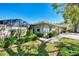 Inviting single-story home with lush landscaping, a screened-in porch, and a well-manicured lawn at 4091 Center Pointe Pl # 40A, Sarasota, FL 34233