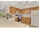 Bright kitchen featuring wooden cabinetry, modern appliances, and a white countertop at 4091 Center Pointe Pl # 40A, Sarasota, FL 34233