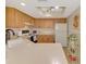 Functional kitchen with wood cabinets, modern appliances, and abundant countertop space at 4091 Center Pointe Pl # 40A, Sarasota, FL 34233
