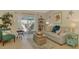 Cozy living room featuring a comfortable sofa, stylish decor, and sliding glass doors to a screened-in patio at 4091 Center Pointe Pl # 40A, Sarasota, FL 34233