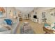 Bright, open-concept living room featuring beach-themed decor and ample natural light at 4091 Center Pointe Pl # 40A, Sarasota, FL 34233
