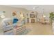 Inviting living area with comfortable seating, coastal accents, and open dining space at 4091 Center Pointe Pl # 40A, Sarasota, FL 34233