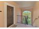 Condo entrance featuring a brown door and staircase at 4118 Central Sarasota Pkwy # 1636, Sarasota, FL 34238