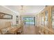 Bright dining room with backyard pool view, chandelier, and natural light at 4848 Greywood Ln, Sarasota, FL 34235