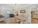Comfortable dining room featuring a ceiling fan and view to the living room at 4848 Greywood Ln, Sarasota, FL 34235