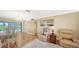 Inviting living room with hardwood floors, comfortable seating, and sliding doors to the pool at 4848 Greywood Ln, Sarasota, FL 34235