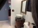 Bathroom with vessel sink, granite counters, and a unique dark wood mirror at 5013 Village Gardens Dr # 34, Sarasota, FL 34234