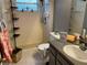 Bathroom featuring a stand up shower, tiled floor, and open shelving at 5013 Village Gardens Dr # 34, Sarasota, FL 34234