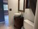 Bathroom vanity with vessel sink, vintage-style mirror, and tile floors at 5013 Village Gardens Dr # 34, Sarasota, FL 34234