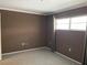 Neutral bedroom featuring carpeted floors and window providing natural light at 5013 Village Gardens Dr # 34, Sarasota, FL 34234