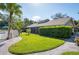 Community recreational center featuring a pool area and lush landscaping at 5013 Village Gardens Dr # 34, Sarasota, FL 34234