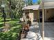 Welcoming home exterior with lush landscaping, a cozy carport, and inviting curb appeal at 5013 Village Gardens Dr # 34, Sarasota, FL 34234