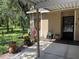 Charming front entrance with decorative potted plants and cozy curb appeal at 5013 Village Gardens Dr # 34, Sarasota, FL 34234
