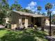 Charming home with a well-manicured front yard, mature landscaping, and inviting entrance at 5013 Village Gardens Dr # 34, Sarasota, FL 34234
