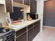 Cozy kitchen area features stainless steel appliances, light countertops, and open design at 5013 Village Gardens Dr # 34, Sarasota, FL 34234