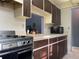Functional kitchen equipped with a range and ample countertop space, illuminated by overhead lighting at 5013 Village Gardens Dr # 34, Sarasota, FL 34234