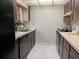 Compact kitchen with stainless steel appliances, light countertops, and tile floors at 5013 Village Gardens Dr # 34, Sarasota, FL 34234