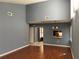 Living room with hardwood floors, an open layout, clerestory windows and access to other rooms at 5013 Village Gardens Dr # 34, Sarasota, FL 34234