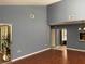 Spacious living room featuring hardwood floors and an open layout that connects to other areas of the home at 5013 Village Gardens Dr # 34, Sarasota, FL 34234