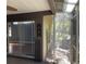 Screened lanai with sliding doors leading to other rooms in the house at 5013 Village Gardens Dr # 34, Sarasota, FL 34234