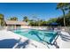 Community swimming pool and surrounding seating area, perfect for relaxation and recreation at 5013 Village Gardens Dr # 34, Sarasota, FL 34234