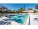 Inviting swimming pool with lounge chairs and a covered pavilion for relaxation at 5013 Village Gardens Dr # 34, Sarasota, FL 34234