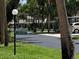 Neighborhood street view featuring well-maintained landscaping and residences at 5013 Village Gardens Dr # 34, Sarasota, FL 34234